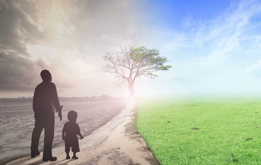 World environment day concept: Father and child standing between climate worsened with good atmosphere World environment day concept: Father and child standing between climate worsened with good atmosphere